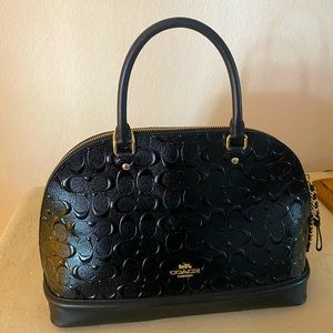 Coach black patent leather purse in very good condition.
